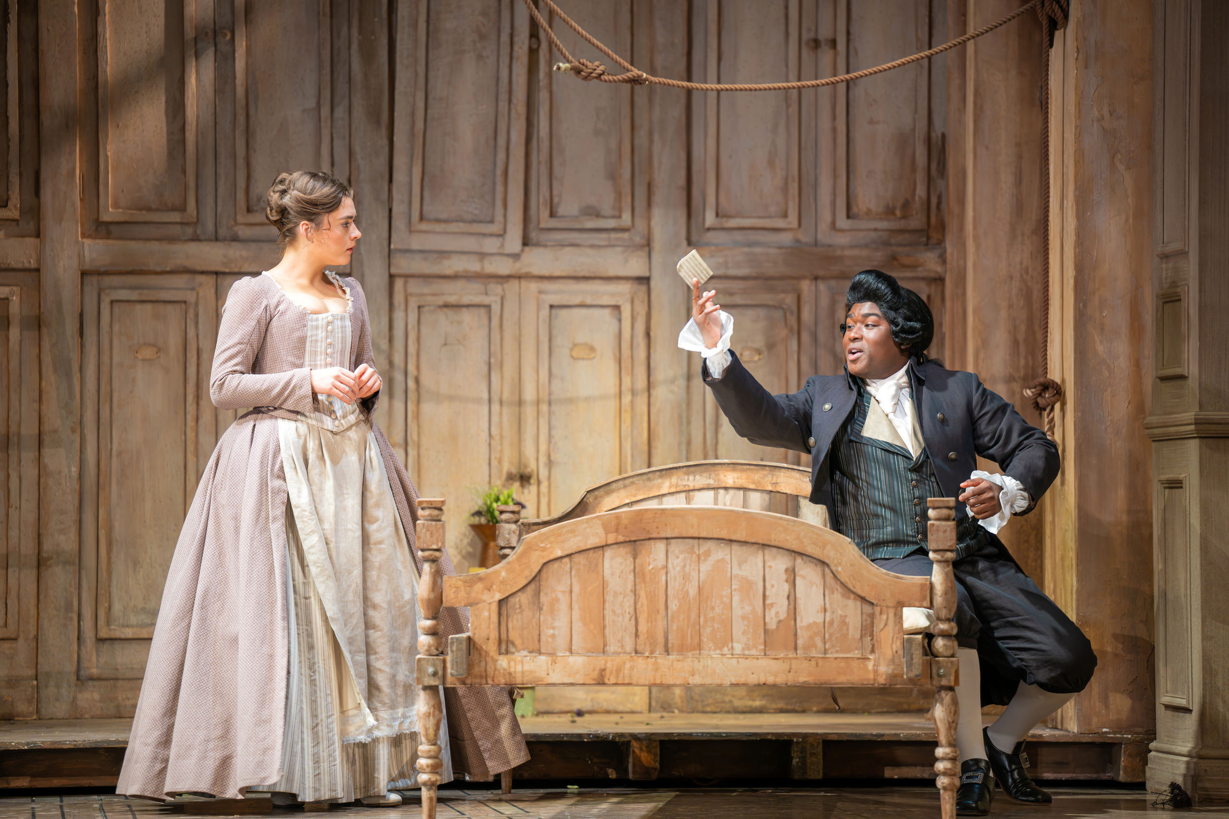 Ava Dodd (Susanna) and Luvo Maranti (Don Basilio & Don Curzio) in The Marriage of Figaro. Scottish Opera 2026. Credit Mihaela Bodlovic..